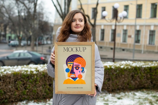 Free Beautiful Frame Model Mockup Held By Girl Psd