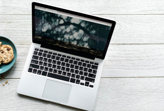 Free Aerial View Of Computer Laptop And Cookies On Wooden Table Psd