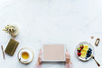 Free Aerial View Of Woman Using A Digital Tablet On A Marble Table With Design Space Psd