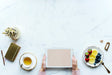Free Aerial View Of Woman Using A Digital Tablet On A Marble Table With Design Space
