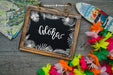 Free Aloha Decoration With Slate And Surfboard Psd