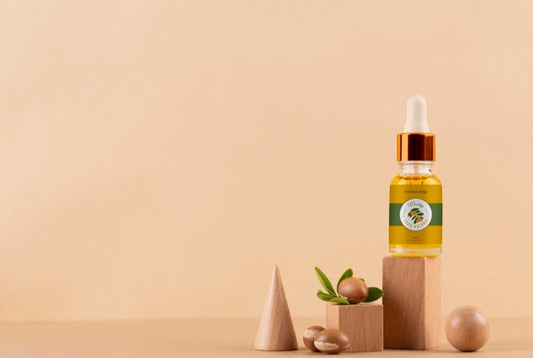 Free Argan Oil Cosmetic Bottle Mock-Up With Wooden-Shaped Podium And Kernels Psd