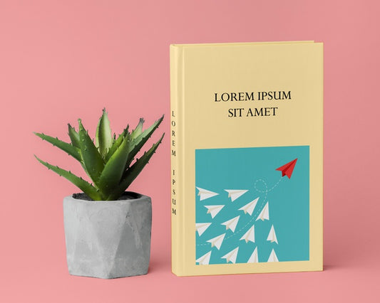 Free Assortment With Book Cover Mock-Up And Plant Psd