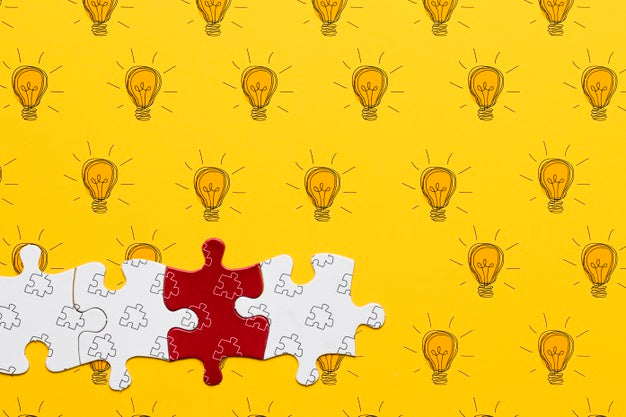 Free Assortment With Puzzle Pieces On Yellow Background Psd