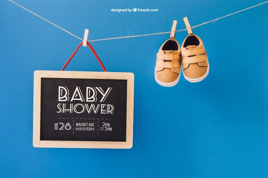 Free Baby Mockup With Shoes And Slate On Clothes Line Psd