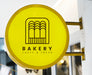 Free Bakery Store'S Yellow Shop Sign Mockup Psd