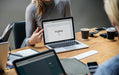 Free Blond Woman Pointing At A Laptop Screen