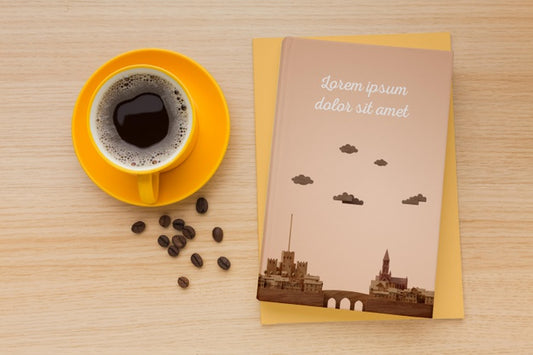 Free Book Cover Assortment On Wooden Background With Cup Of Coffee Psd