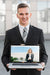 Free Businessman Presenting Laptop Mockup Psd