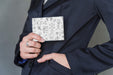 Free Businessman Pulling Notebook Out Of Pocket Psd