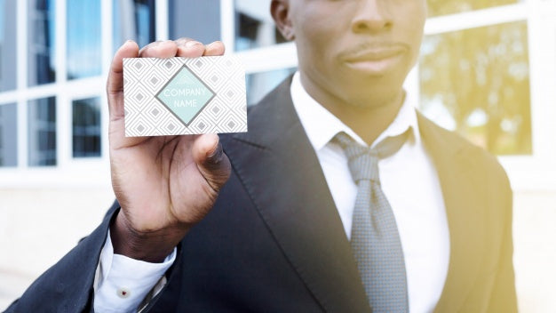 Free Businessman Showing Business Card Psd