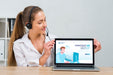 Free Call Center Operator Looking At A Mock-Up Laptop Psd