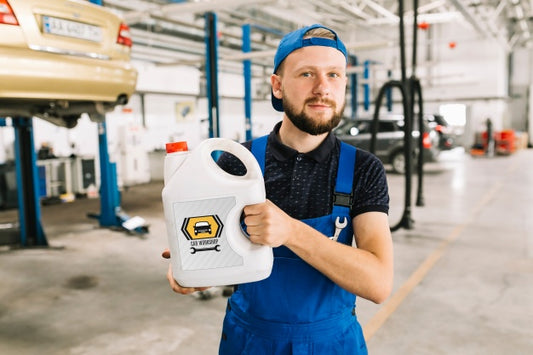 Free Car Mechanic Holding Plastic Can Mockup Psd