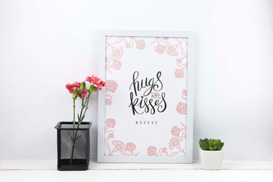 Free Carnation Flowers In Pencil Holder Next To Frame Mockup Psd