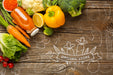 Free Carrot Juice And Vegetables On Wooden Table Psd