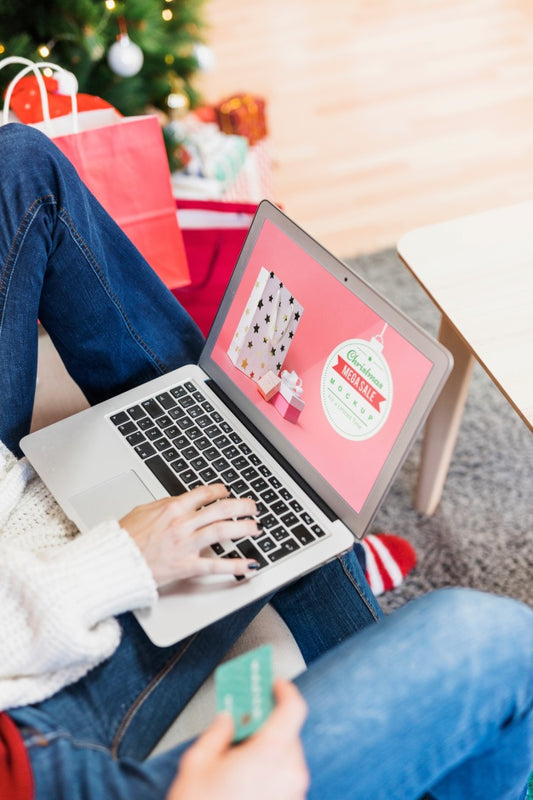 Free Christmas Sale Mockup With Woman Using Laptop Psd