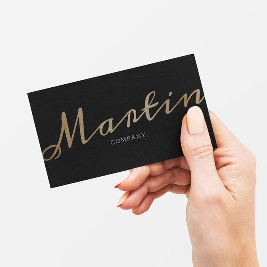 Free Classy Business Card In Black And Gold In A Hand Psd