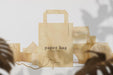 Free Clean Minimal Paper Bag Mockup On Front Wooden Block And Leaves Background. Psd File. Psd