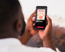 Free Close-Up Man Holding Phone Psd