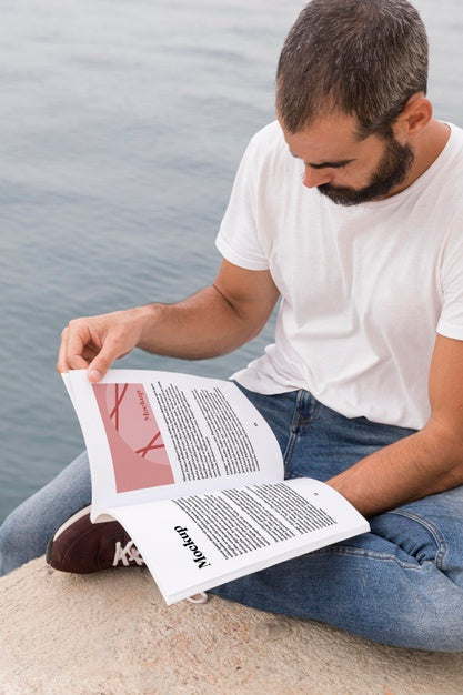 Free Close Up Man On Street Reading Book Psd