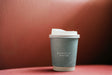 Free Coffee Cup Mockup In A Red Backdrop