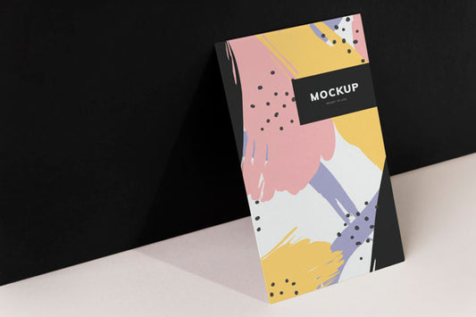 Free Colorful Paperboard Mockup Against The Black Wall Psd