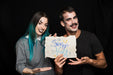 Free Couple Holding Paper With Halloween Lettering Psd