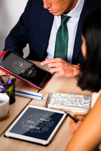 Free Coworkers In A Meeting Using Tablet Psd
