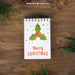 Free Decorative Christmas Mockup With Notepad And Mistletoe Psd