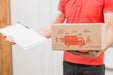 Free Delivery Mockup With Man Holding Box And Clipboard Psd