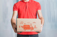 Free Delivery Mockup With Man Holding Box Psd