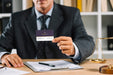 Free Elegant Businessman Presenting Business Card Mocku Psd