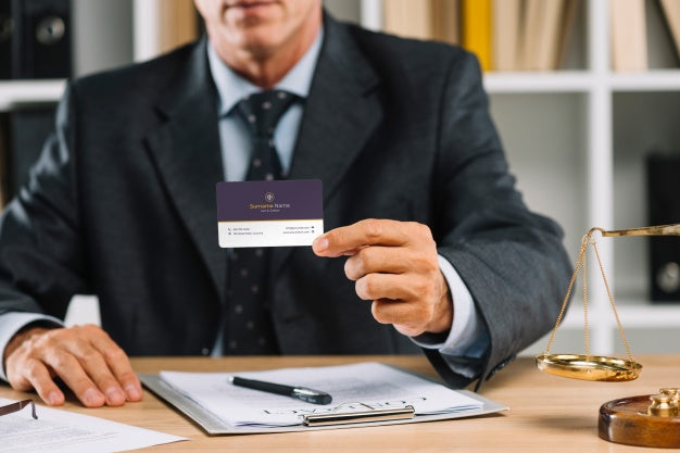 Free Elegant Businessman Presenting Business Card Mocku Psd