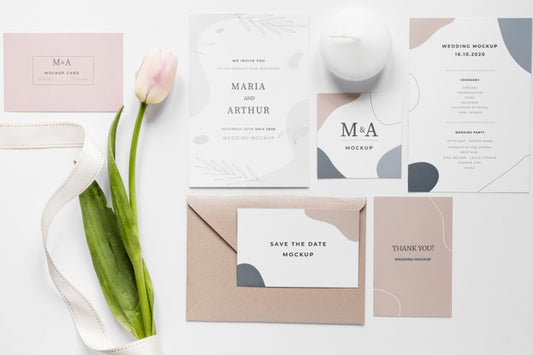 Free Fat Lay Of Wedding Cards With Tulips And Ribbon Psd