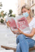 Free Female With Mask On Street Reading Book Psd