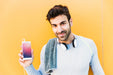 Free Fitness Mockup With Man Showing Smartphone Psd