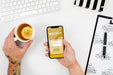 Free Flat Lay Hands Holding Smartphone Mock-Up And Tea Psd