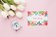Free Flat Lay Of Card With Tulips And Clock Psd