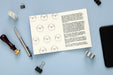Free Flat Lay Of Desk Surface With Pen And Notepad Psd
