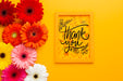 Free Flat Lay Of Frame And Flowers On Yellow Background Psd