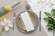 Free Flat Lay Of Spring Menu Mock-Up On Plates With Wine Bottle And Cutlery Psd