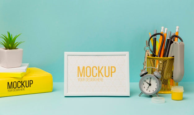 Free Frame Surrounded By Pencils And Alarm Clock With Mock-Up Psd