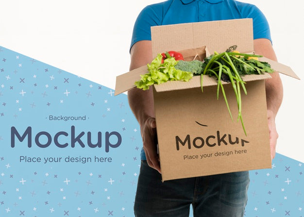 Free Front View Delivery Man Holding A Box With Different Vegetables Psd