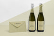 Free Front View Envelope And Champagne Bottles Mock-Up Psd