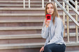 Free Front View Modern Blonde Girl Holding A Cup Of Coffee Mock-Up Psd