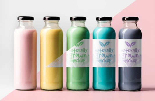 Free Front View Of Assortment Of Transparent Juice Bottles With Cap Psd