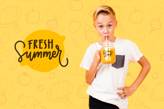Free Front View Of Child Drinking Juice And Posing Psd