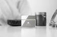 Free Front View Of Cosmetic Bottles On The Table With Defocused Woman Psd