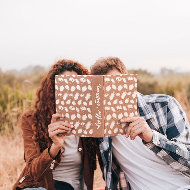 Free Front View Of Couple Looking In A Book Psd