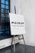 Free Front View Of Easel With Canvas For Painter Mock-Up Psd